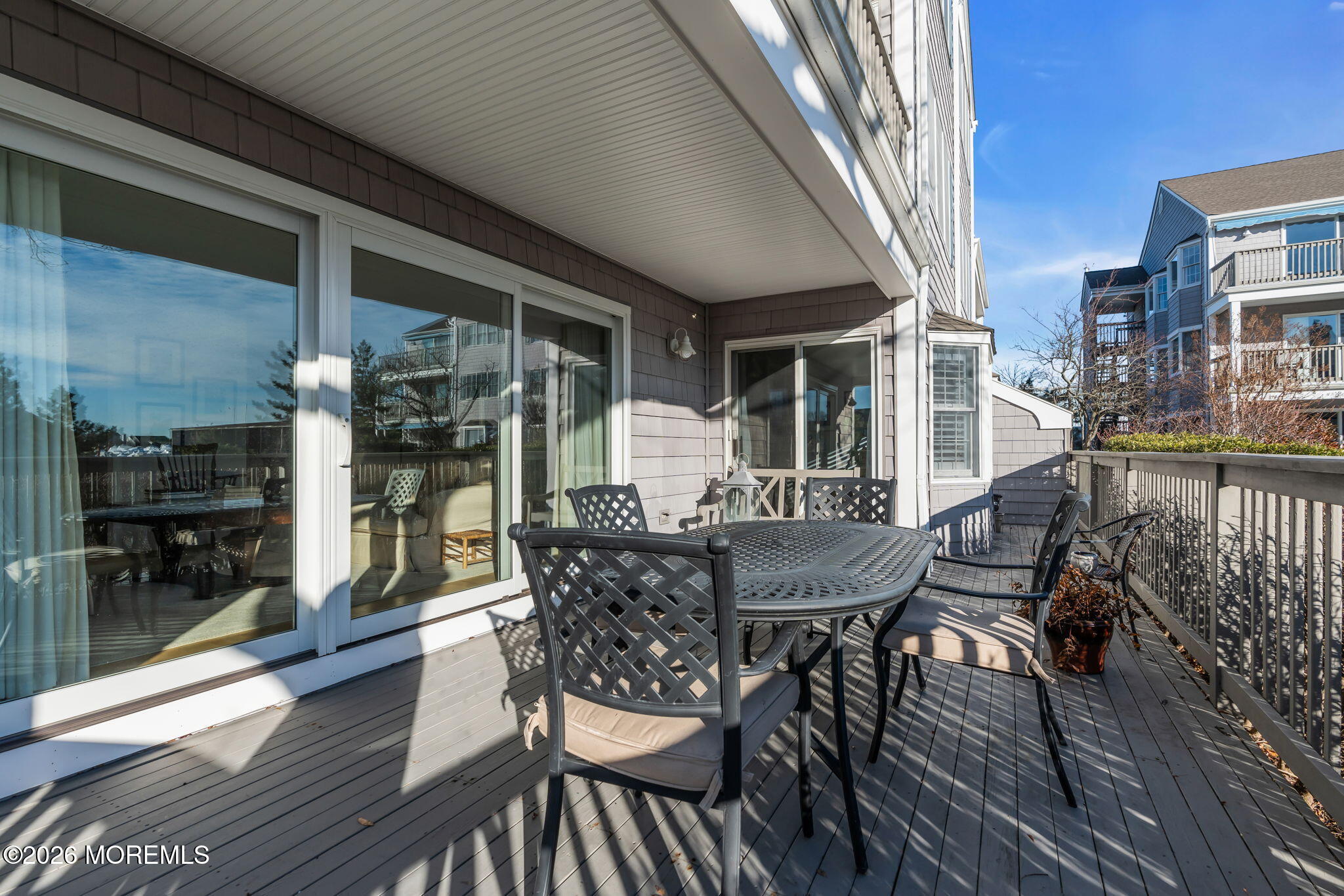 97 Bay Point Harbour Point Pleasant, NJ 08742 - Photo 33 of 54 a view of a roof deck with table and chairs and wooden floor