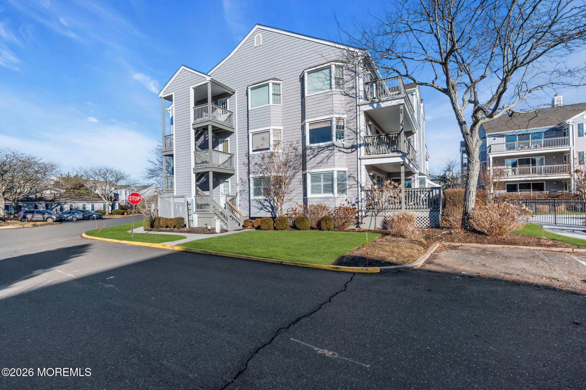97 Bay Point Harbour Point Pleasant, NJ 08742 - Photo 38 of 54 a front view of a building with garden and trees