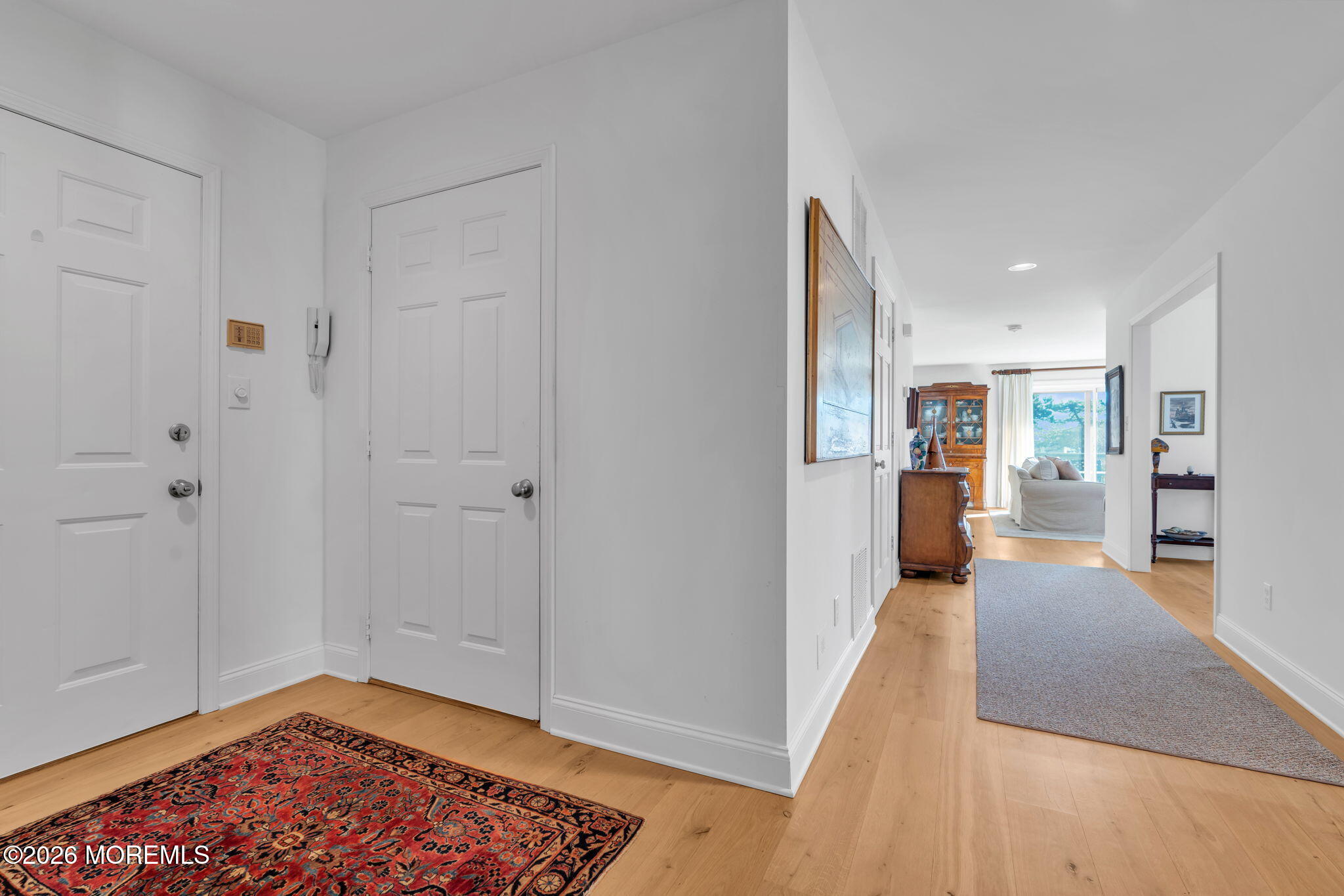 97 Bay Point Harbour Point Pleasant, NJ 08742 - Photo 5 of 54 a view of a hallway with wooden floor and a living room