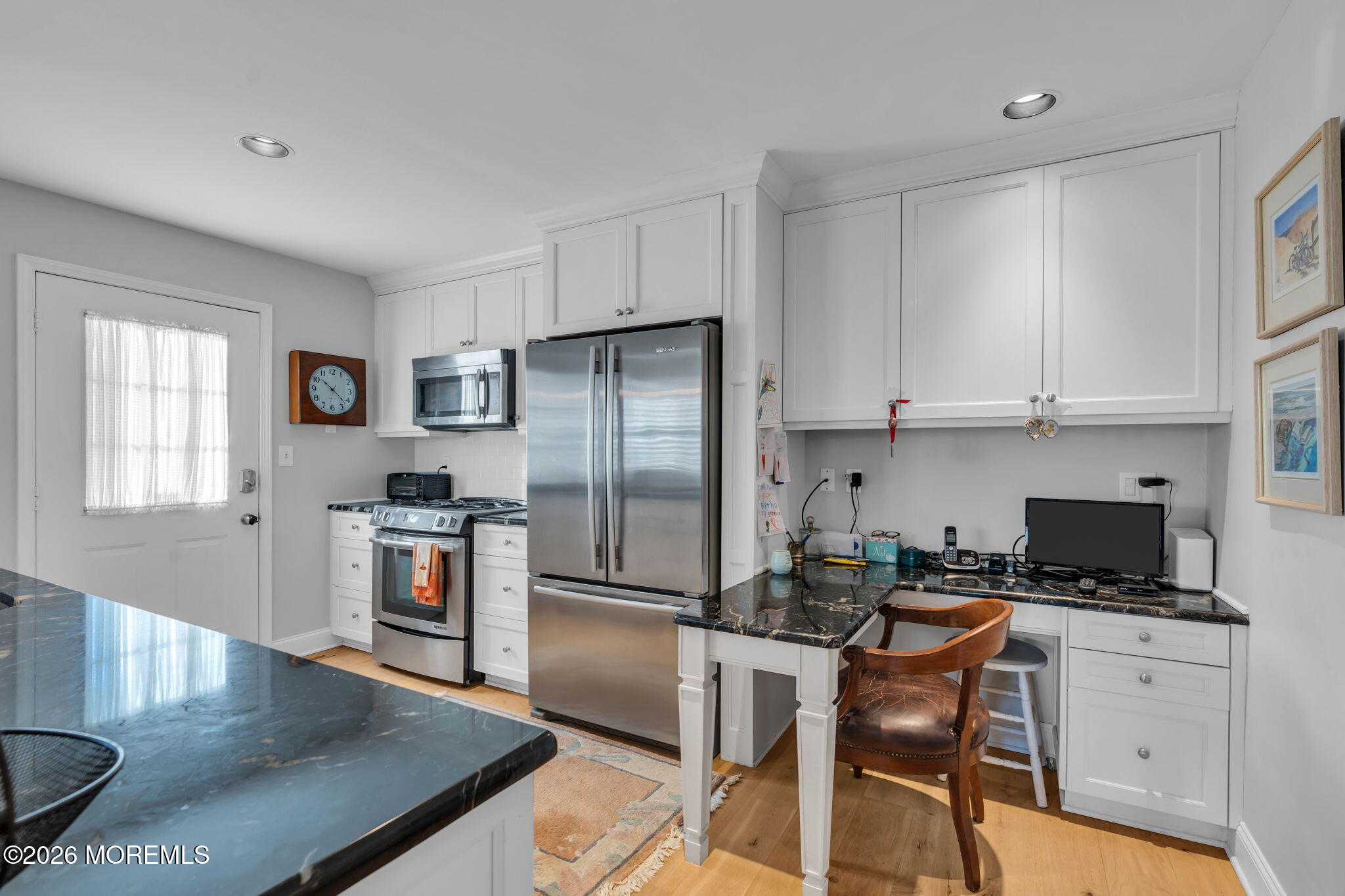 97 Bay Point Harbour Point Pleasant, NJ 08742 - Photo 8 of 54 a kitchen with stainless steel appliances granite countertop a stove a refrigerator a kitchen island a table and chairs in it