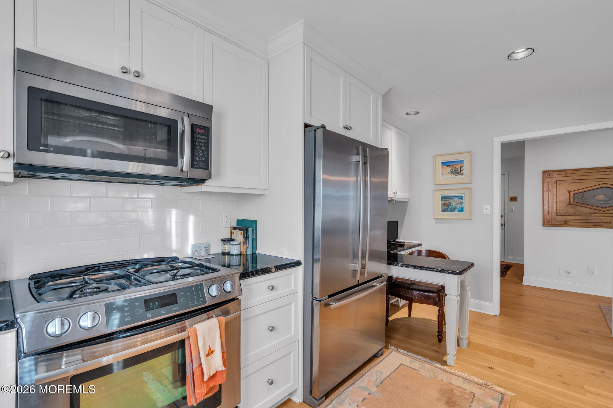 97 Bay Point Harbour Point Pleasant, NJ 08742 - Photo 10 of 54 a kitchen with stainless steel appliances a stove a microwave and a refrigerator