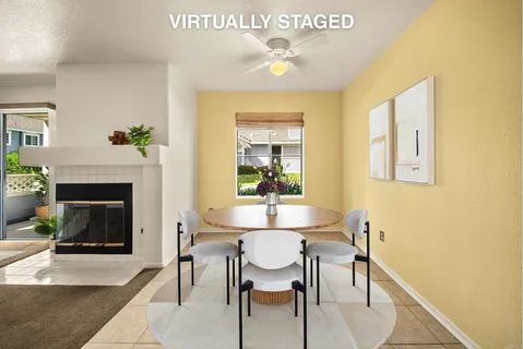 a dining room with furniture and fireplace