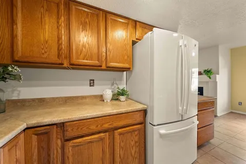 a kitchen with a sink and a refrigerator