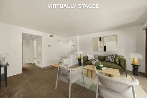 a living room with furniture and a table