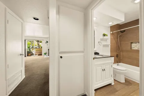 a bedroom with a bed and a couch