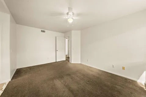 a view of livingroom and kitchen with microwave