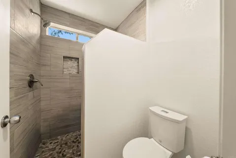 a view of backyard with a chair