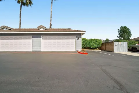 a living room with fireplace furniture and a large window