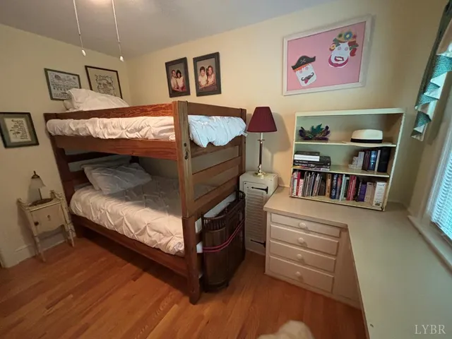 a bedroom with furniture and baby crib