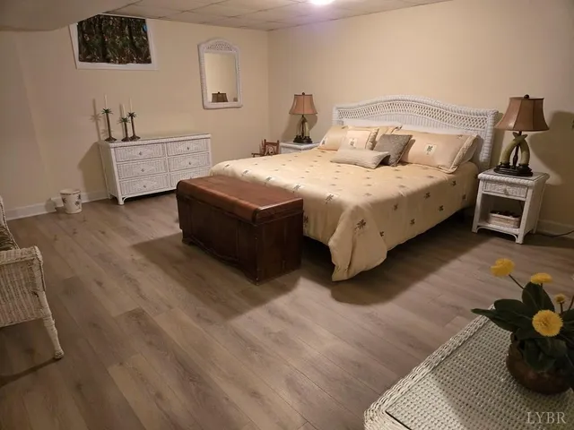 a bedroom with a bed and a couch