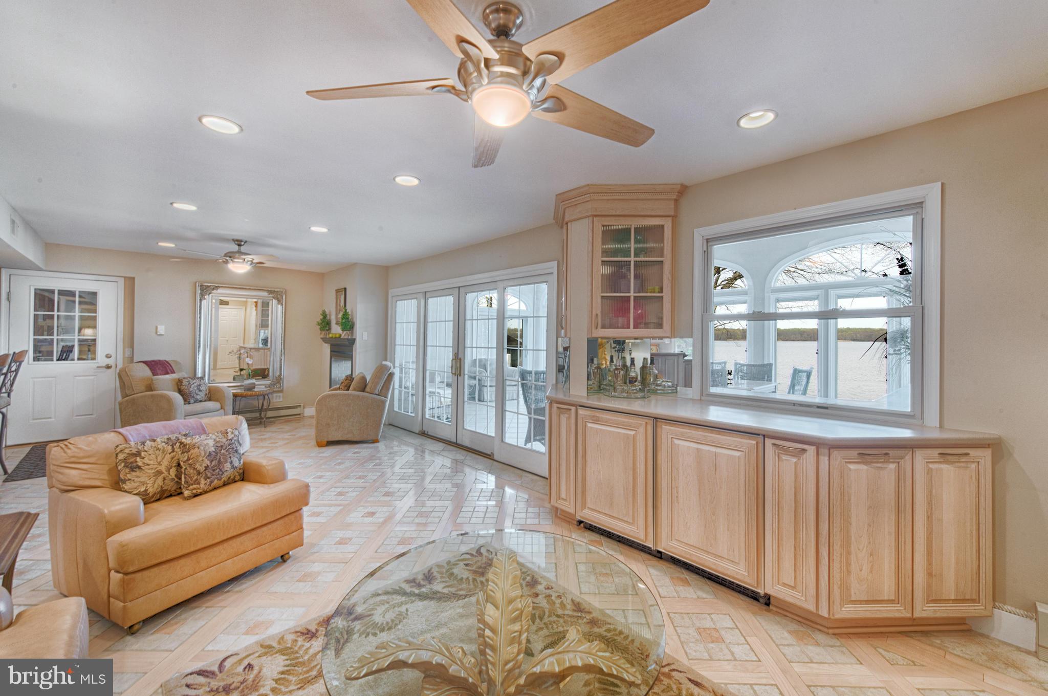 389 River Road Elkton, MD 21921 - Photo 18 of 30 Open floor plan w/ bar, frig, & sliders to sunroom