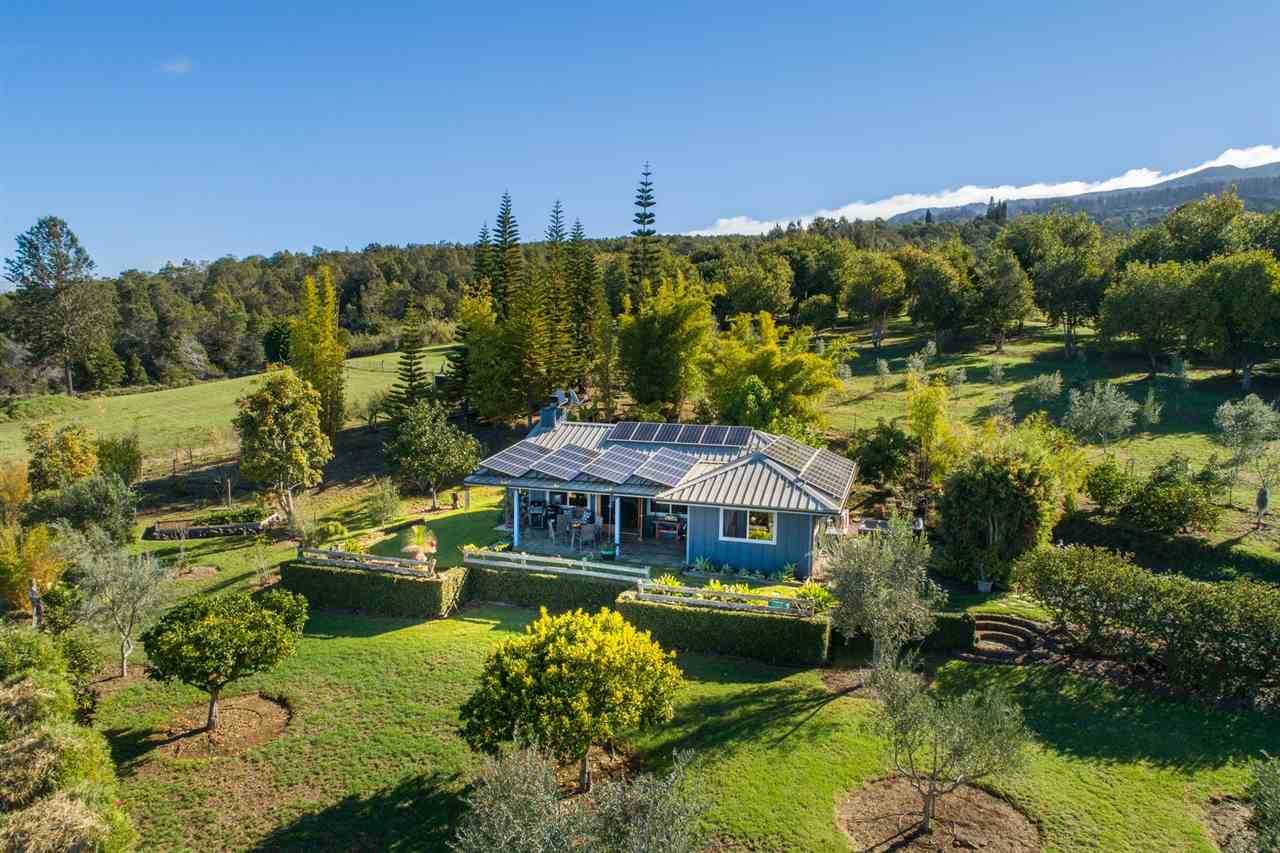 733 Pulehuiki Road Kula, HI 96790 - Photo 1 of 1 a aerial view of a house with swimming pool and a yard