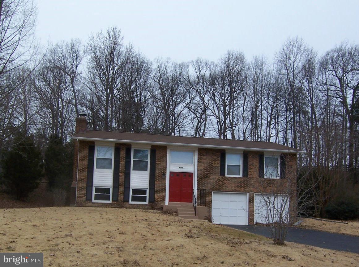 9104 Rookings Court Springfield, VA 22153 - Photo 1 of 22 a front view of a house with a yard