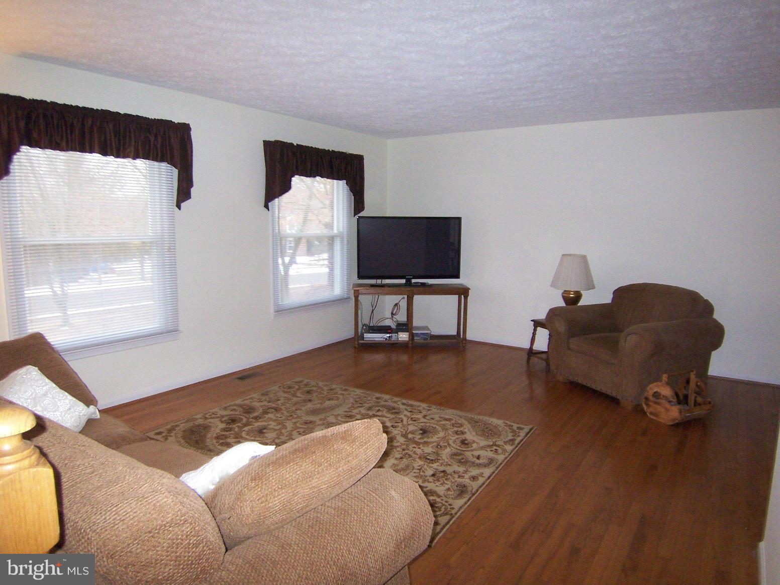 9104 Rookings Court Springfield, VA 22153 - Photo 2 of 22 a living room with furniture and a window