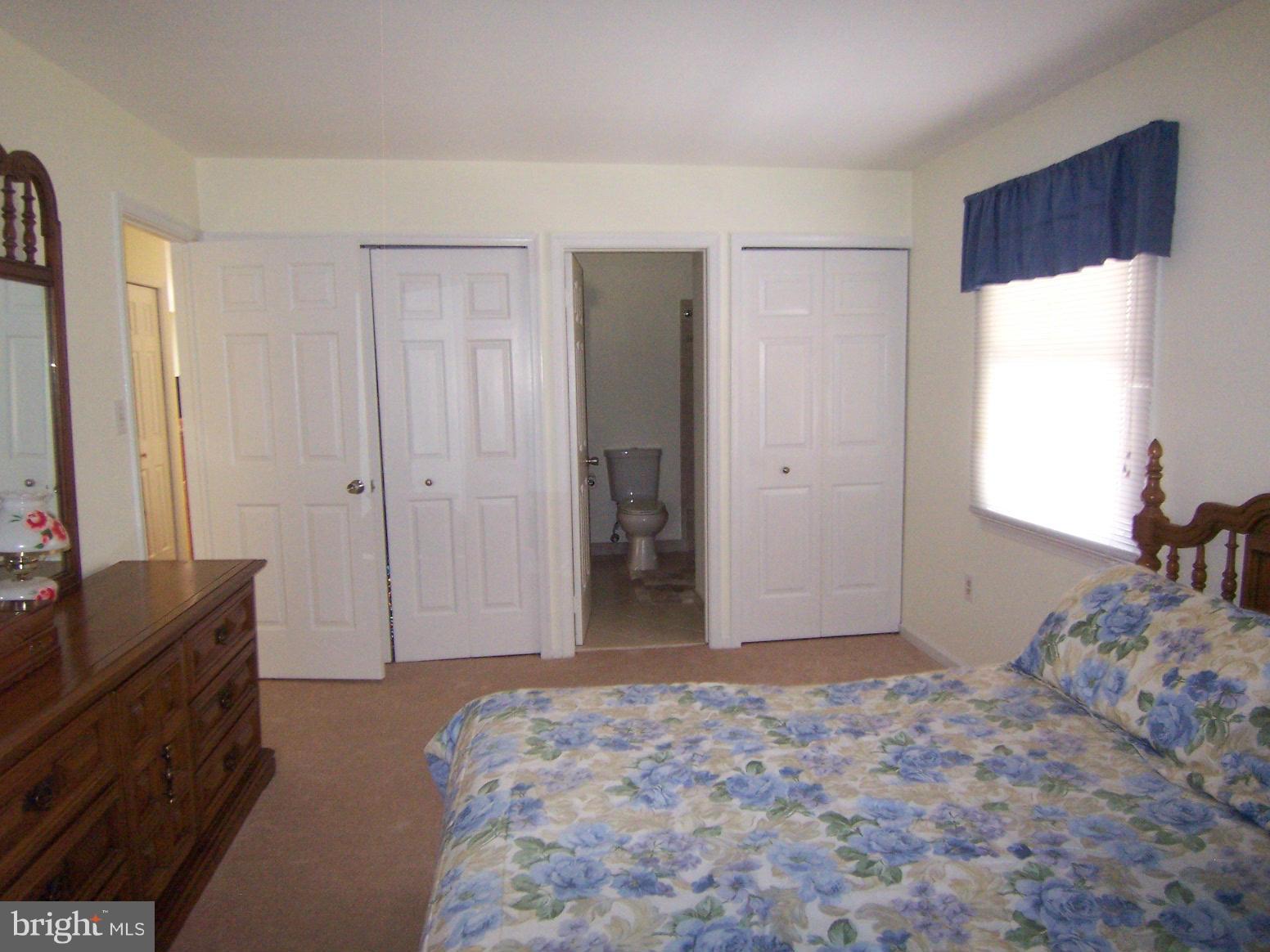 9104 Rookings Court Springfield, VA 22153 - Photo 13 of 22 a bedroom with a bed and a dresser