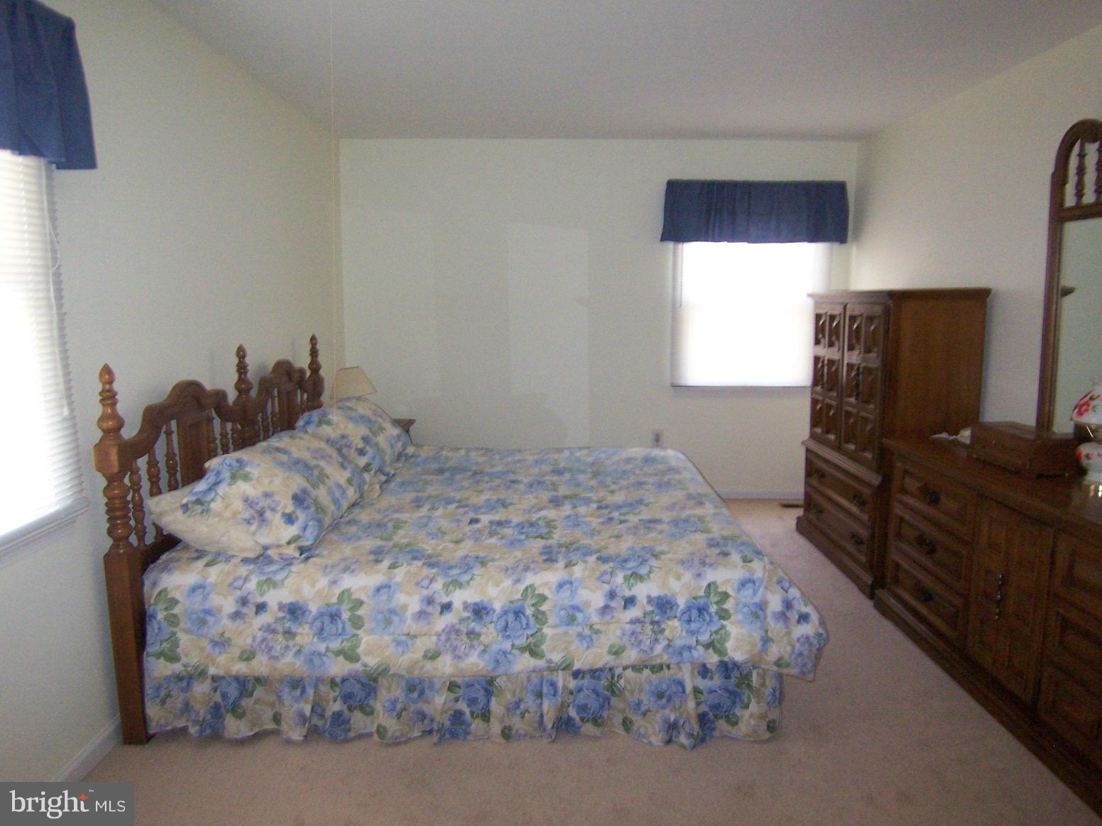9104 Rookings Court Springfield, VA 22153 - Photo 14 of 22 a bedroom with a bed and a television