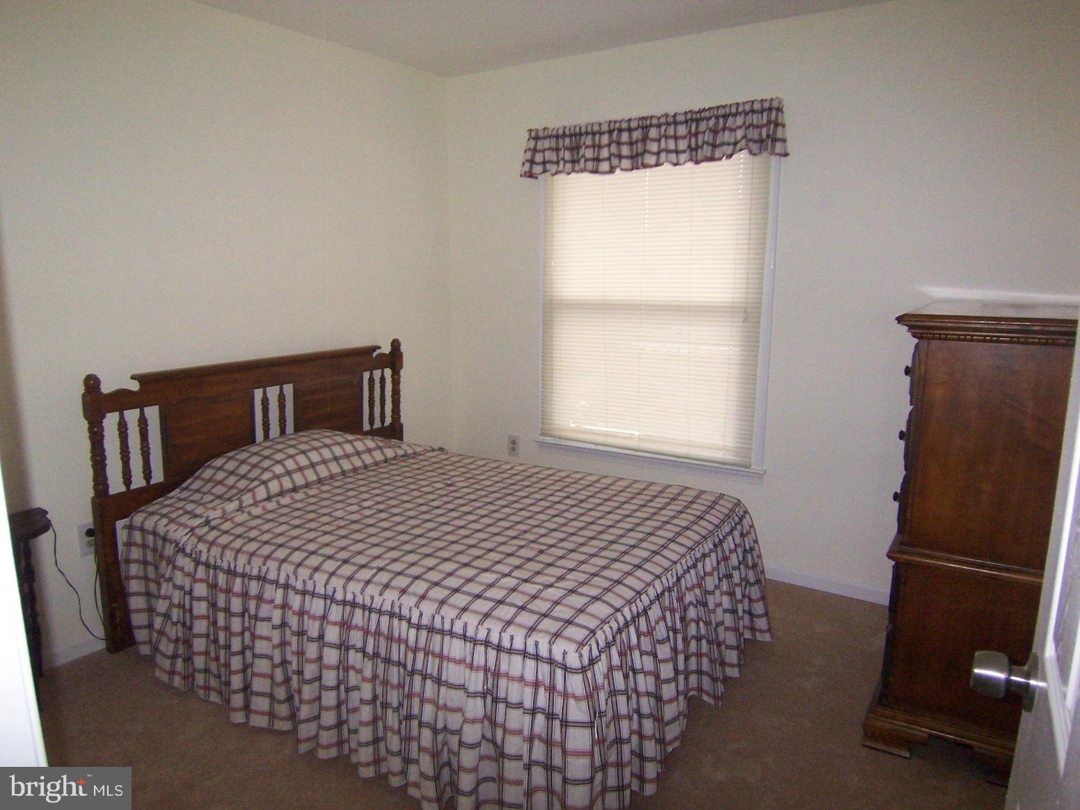 9104 Rookings Court Springfield, VA 22153 - Photo 16 of 22 a bedroom with a bed and window