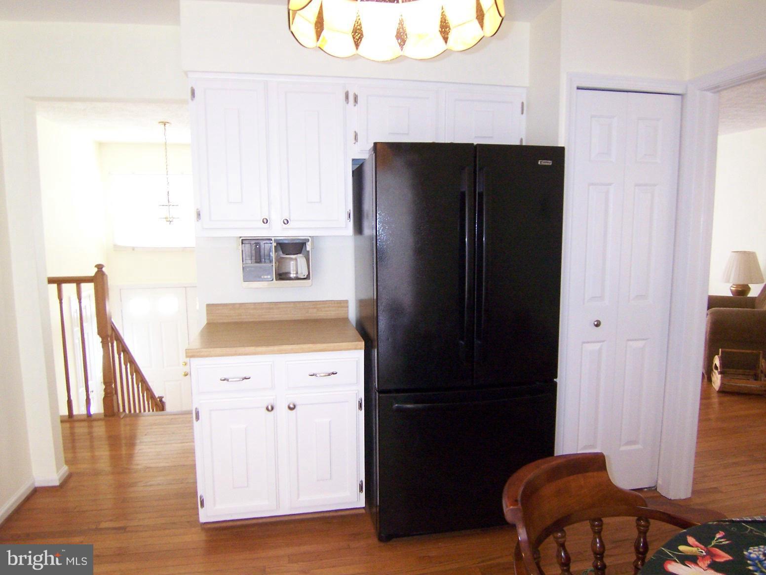 9104 Rookings Court Springfield, VA 22153 - Photo 10 of 22 a kitchen with a refrigerator and a stove