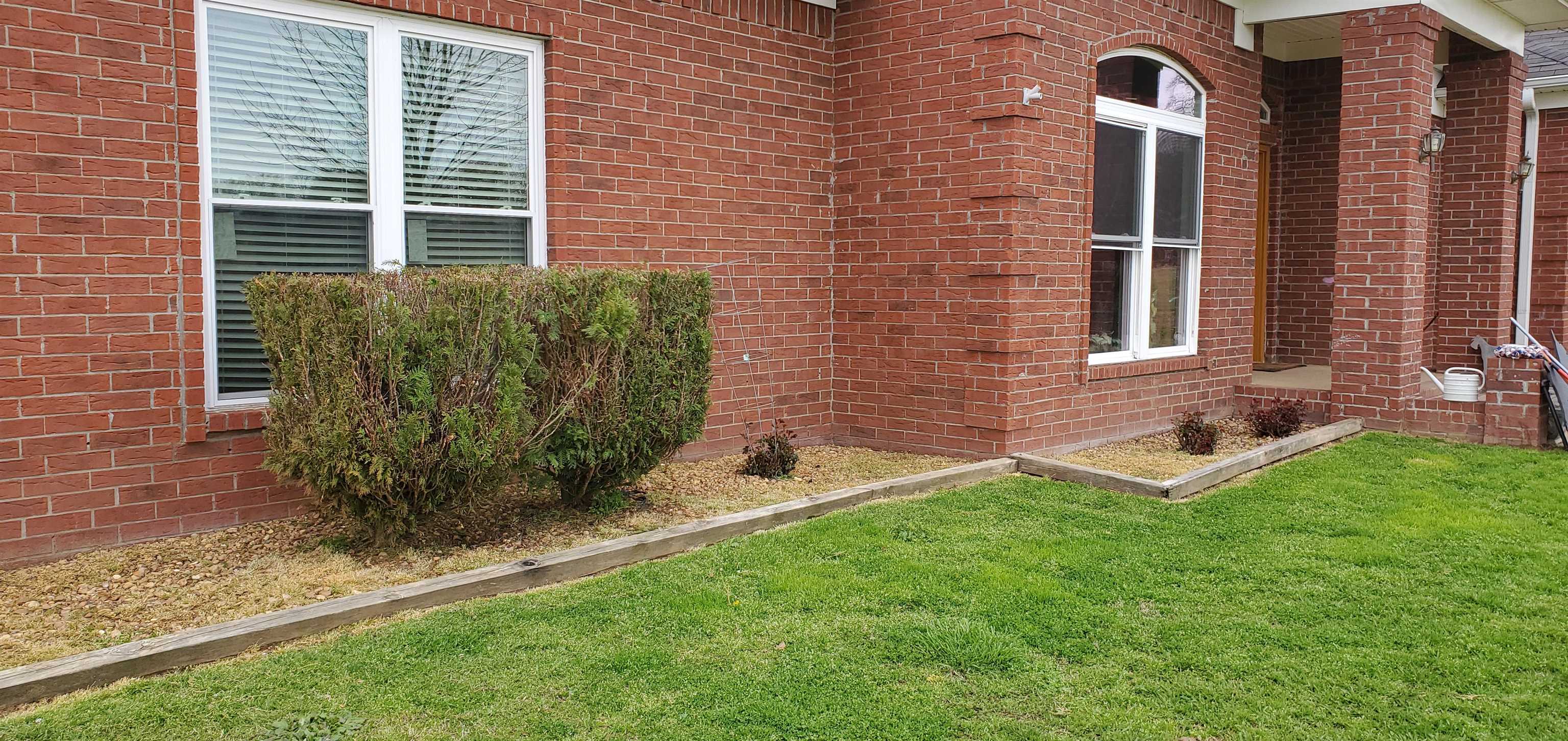 110 R W Anderson Road Mason, TN 38049 - Photo 2 of 23 a front view of a house with garden
