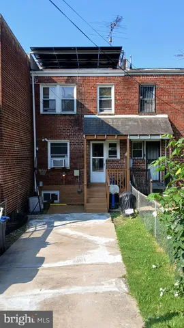 a view of a house with a yard porch and sitting area