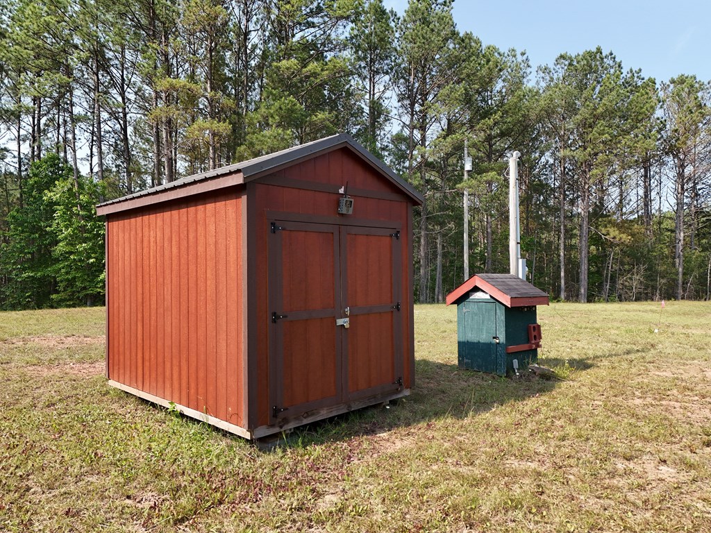 278 Golf Course Road Copperhill, TN 37317 - Photo 10 of 45 a view of backyard with a barn and large trees
