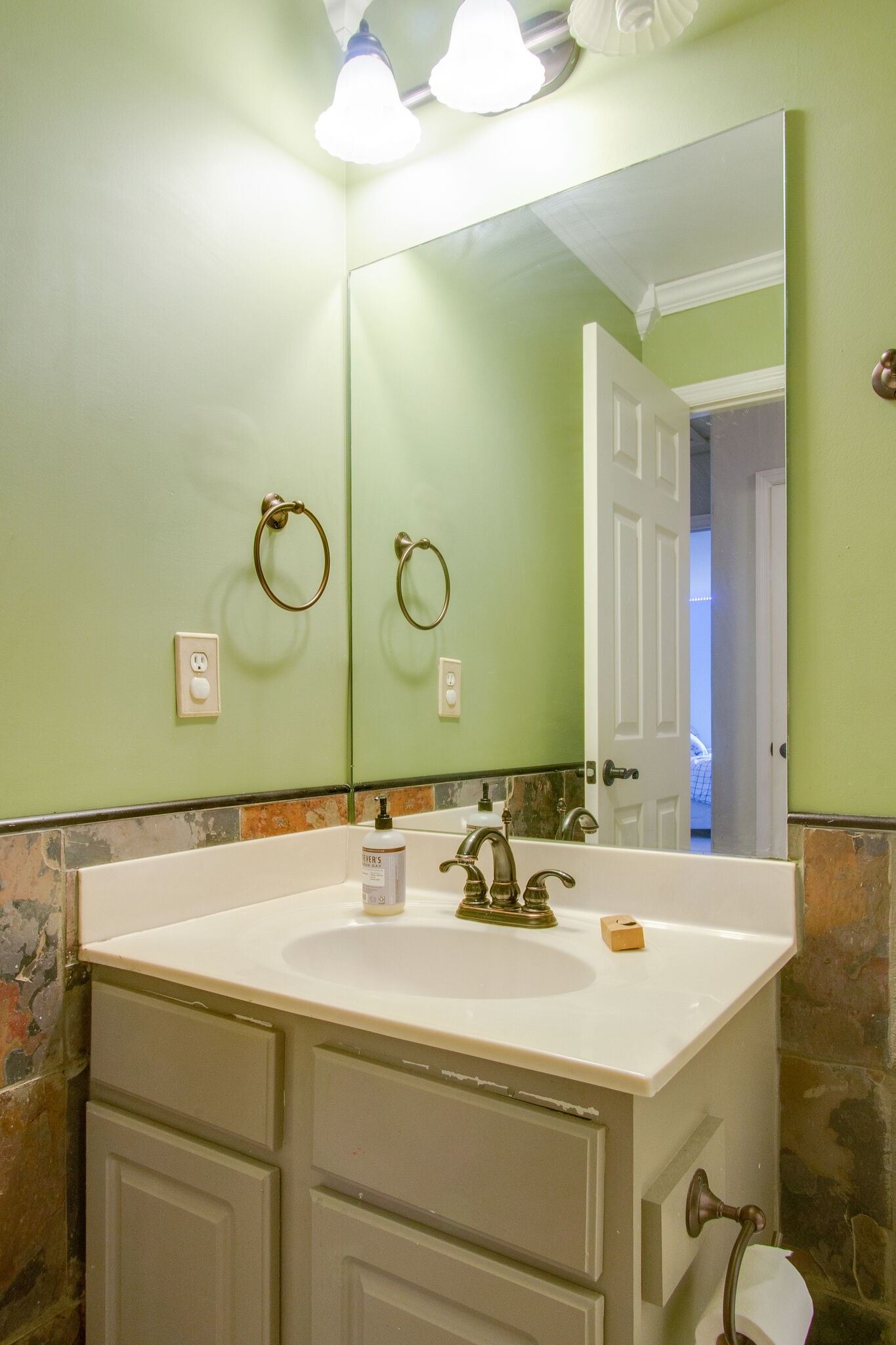 7020 Red Apple Road Antioch, TN 37013 - Photo 24 of 28 a bathroom with a sink and a mirror