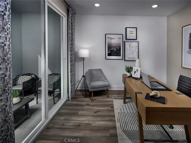 a living room with furniture and a lamp