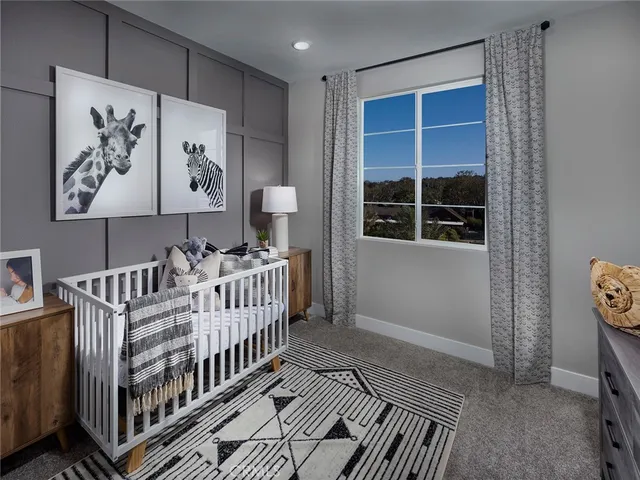 a view of a hallway with wooden floor and windows