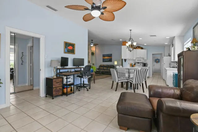 a spacious bathroom with a sink a toilet a large mirror and shower