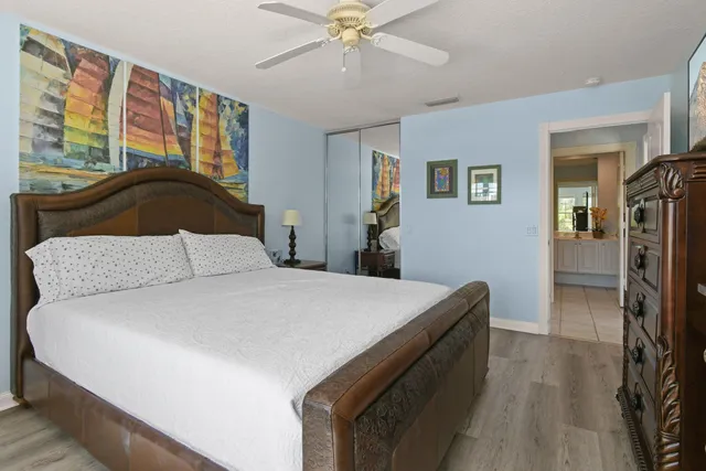 a utility room with cabinets washer and dryer