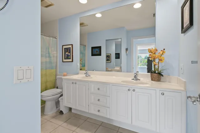 a view of a room with a window and wooden floor