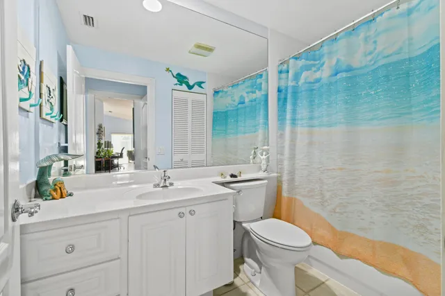 a view of a table and chairs in back yard of the house