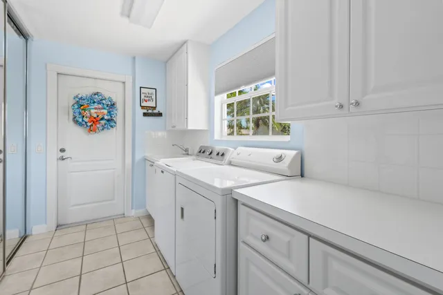 a view of a house with a yard and a garden