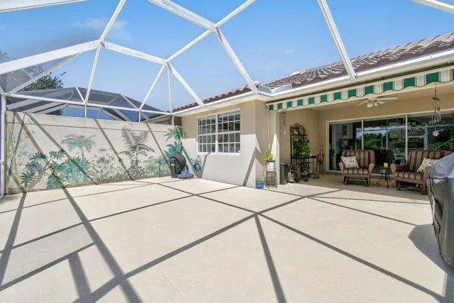 an aerial view of residential houses with outdoor space and swimming pool