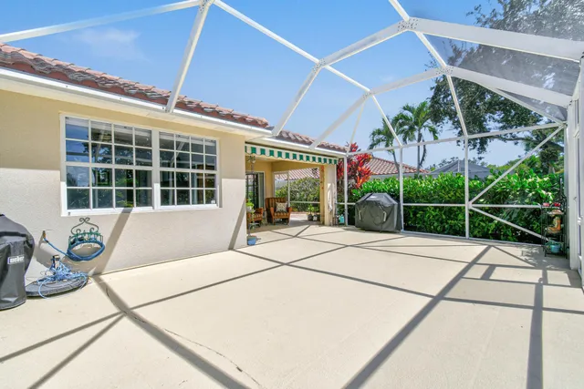 an aerial view of residential houses with outdoor space and city view