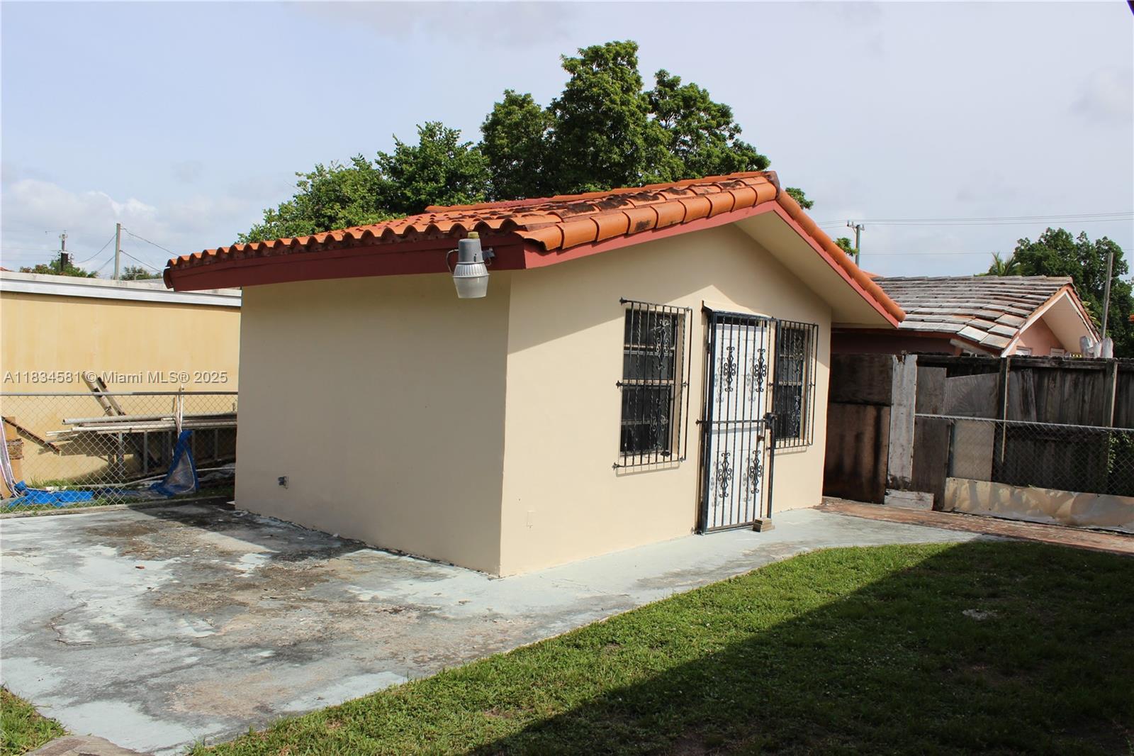 2216 Southwest 62nd Avenue Miami, FL 33155 - Photo 13 of 14 a view of a house with a yard and porch