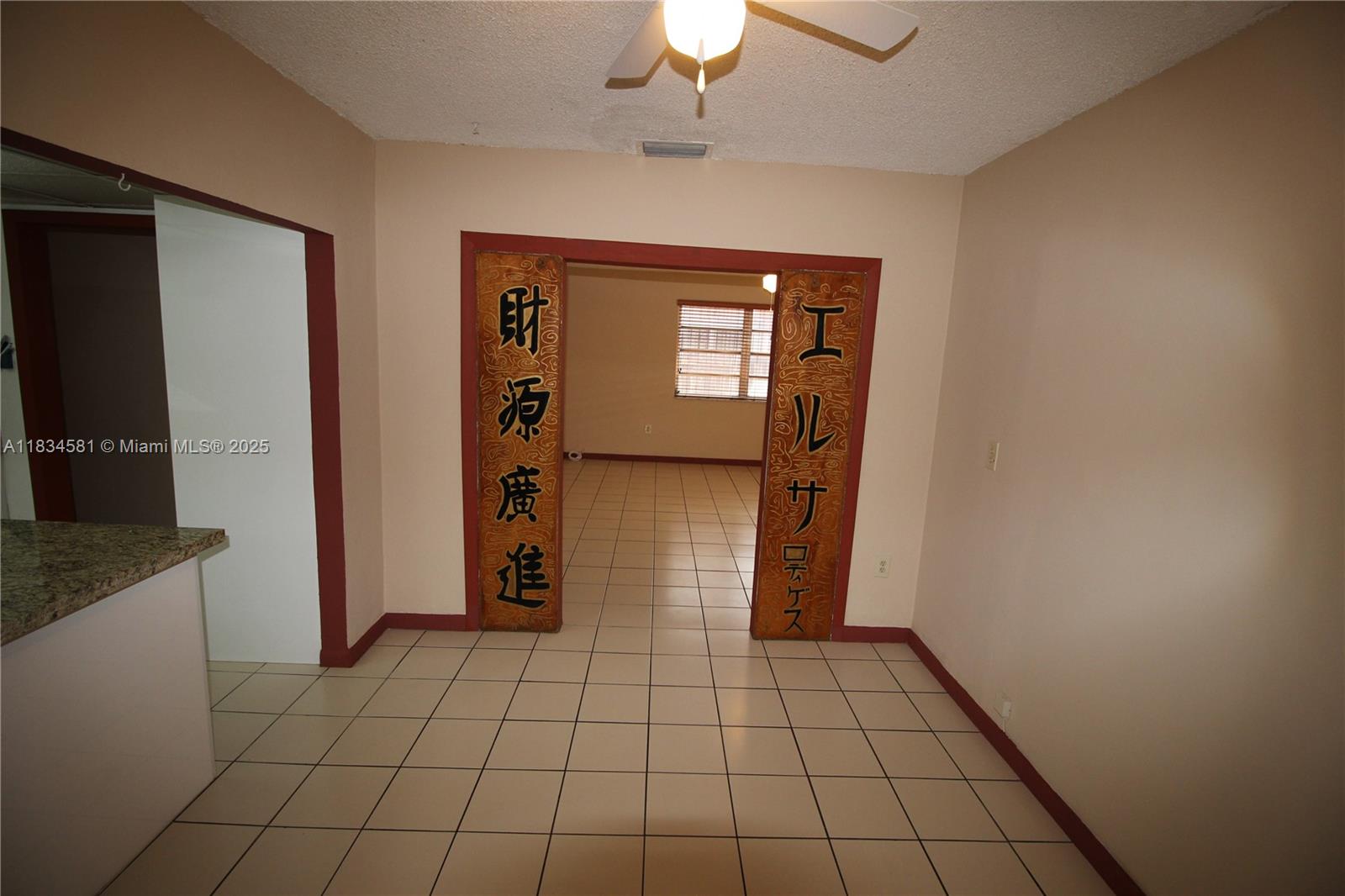 2216 Southwest 62nd Avenue Miami, FL 33155 - Photo 4 of 14 a view of an empty room and window