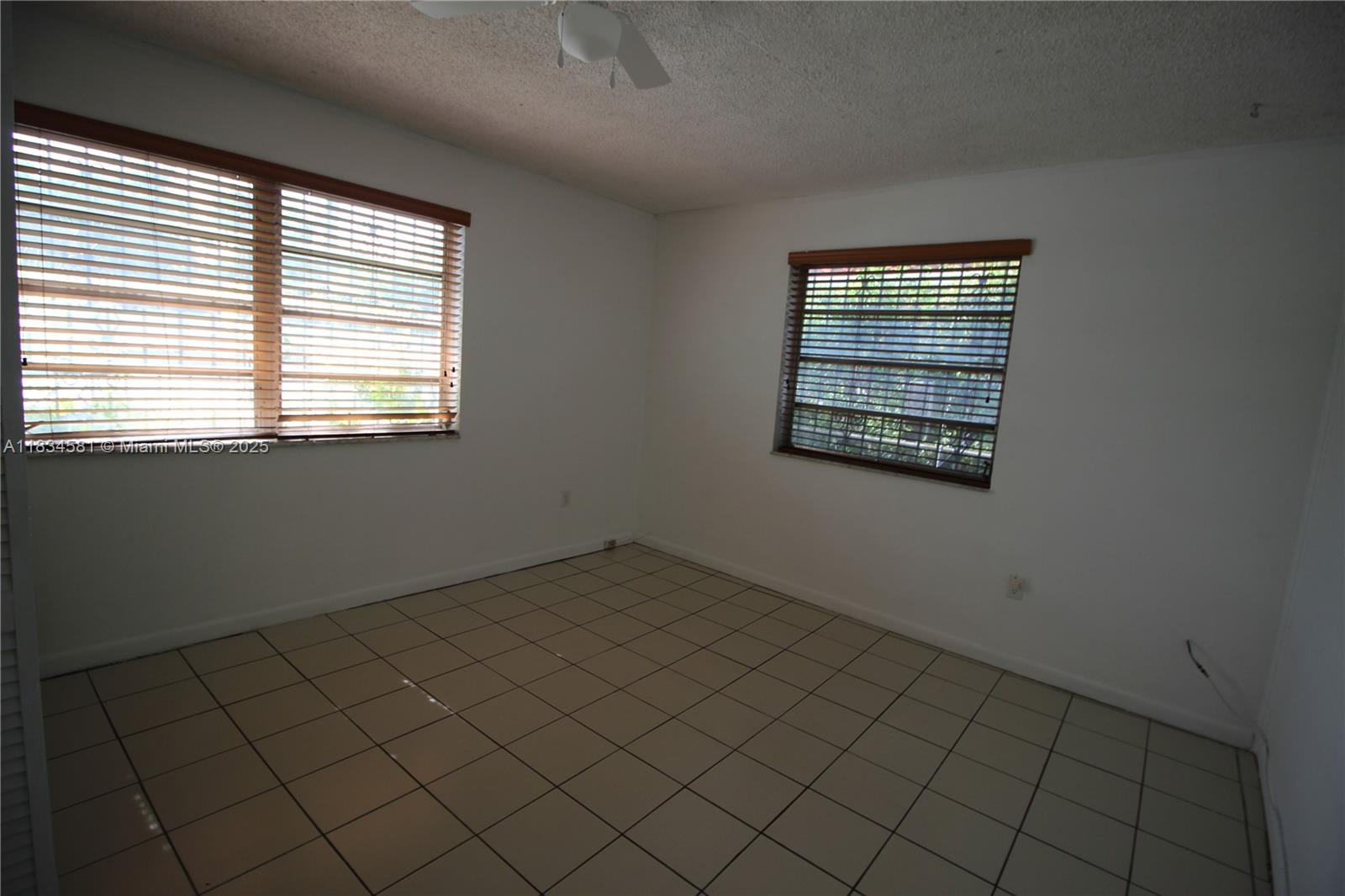 2216 Southwest 62nd Avenue Miami, FL 33155 - Photo 5 of 14 an empty room with a window