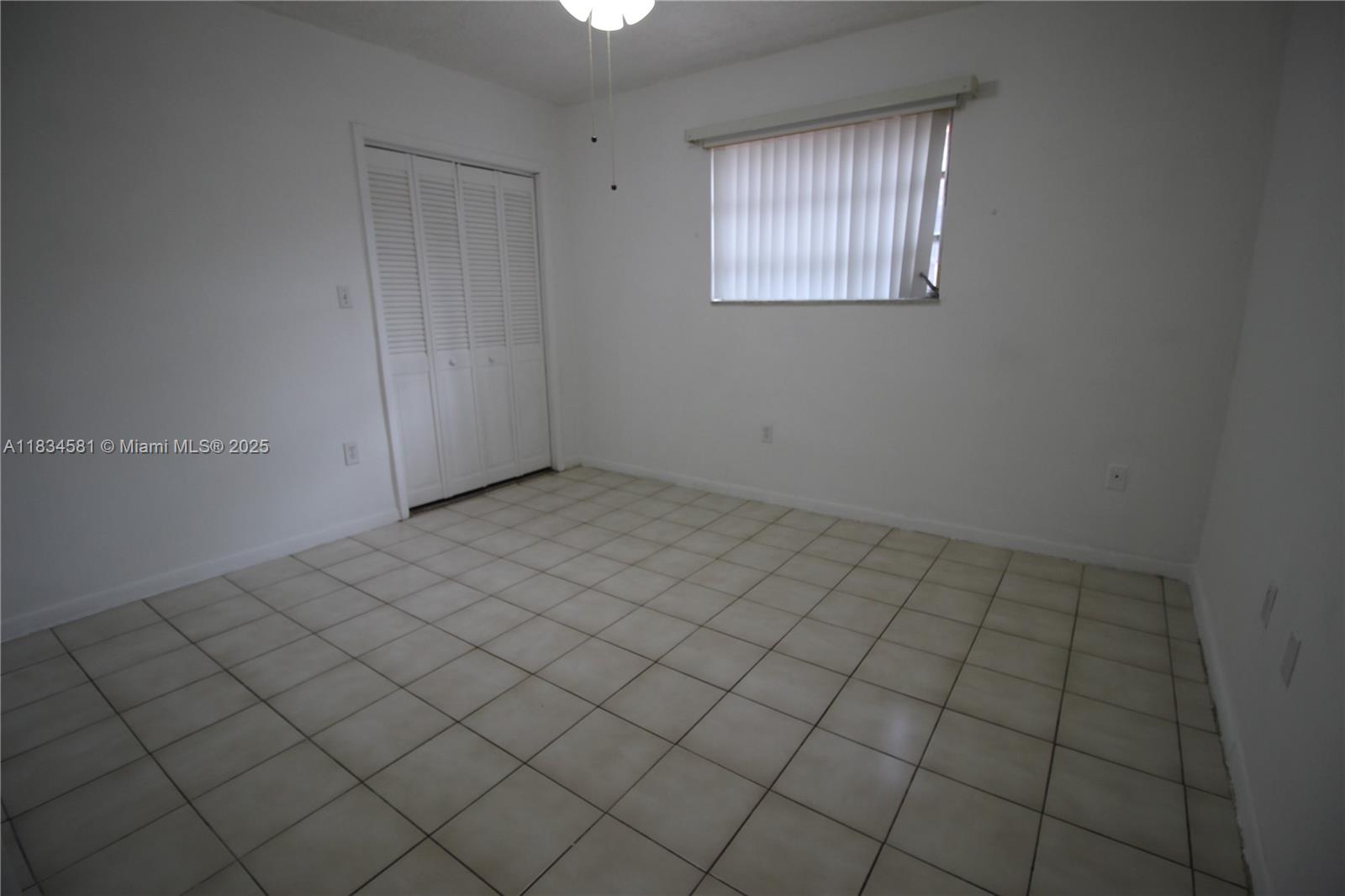 2216 Southwest 62nd Avenue Miami, FL 33155 - Photo 7 of 14 an empty room with windows