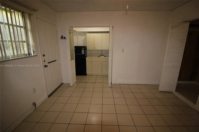 a view of an empty room and window