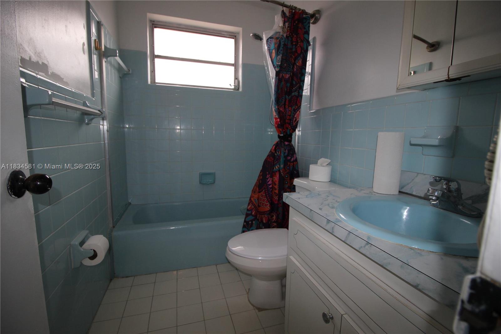 2216 Southwest 62nd Avenue Miami, FL 33155 - Photo 9 of 14 a bathroom with a sink a toilet and shower