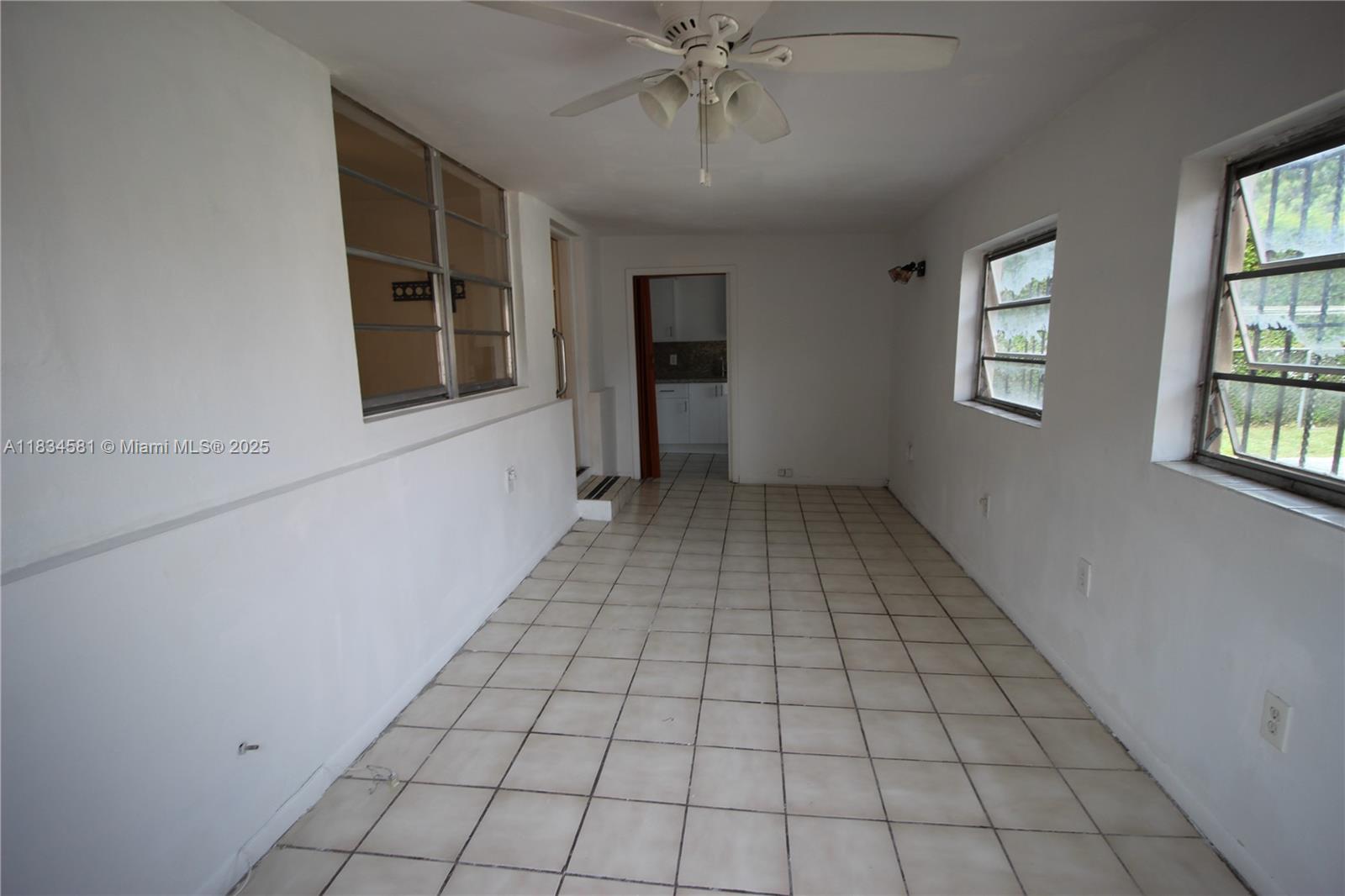 2216 Southwest 62nd Avenue Miami, FL 33155 - Photo 10 of 14 a view of an empty room with a window