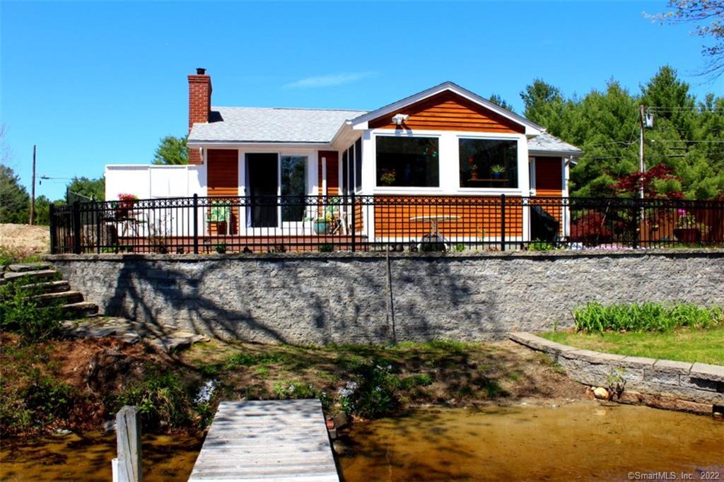 6 Logee Road Thompson, CT 06277 - Photo 1 of 1 a front view of a house with a yard