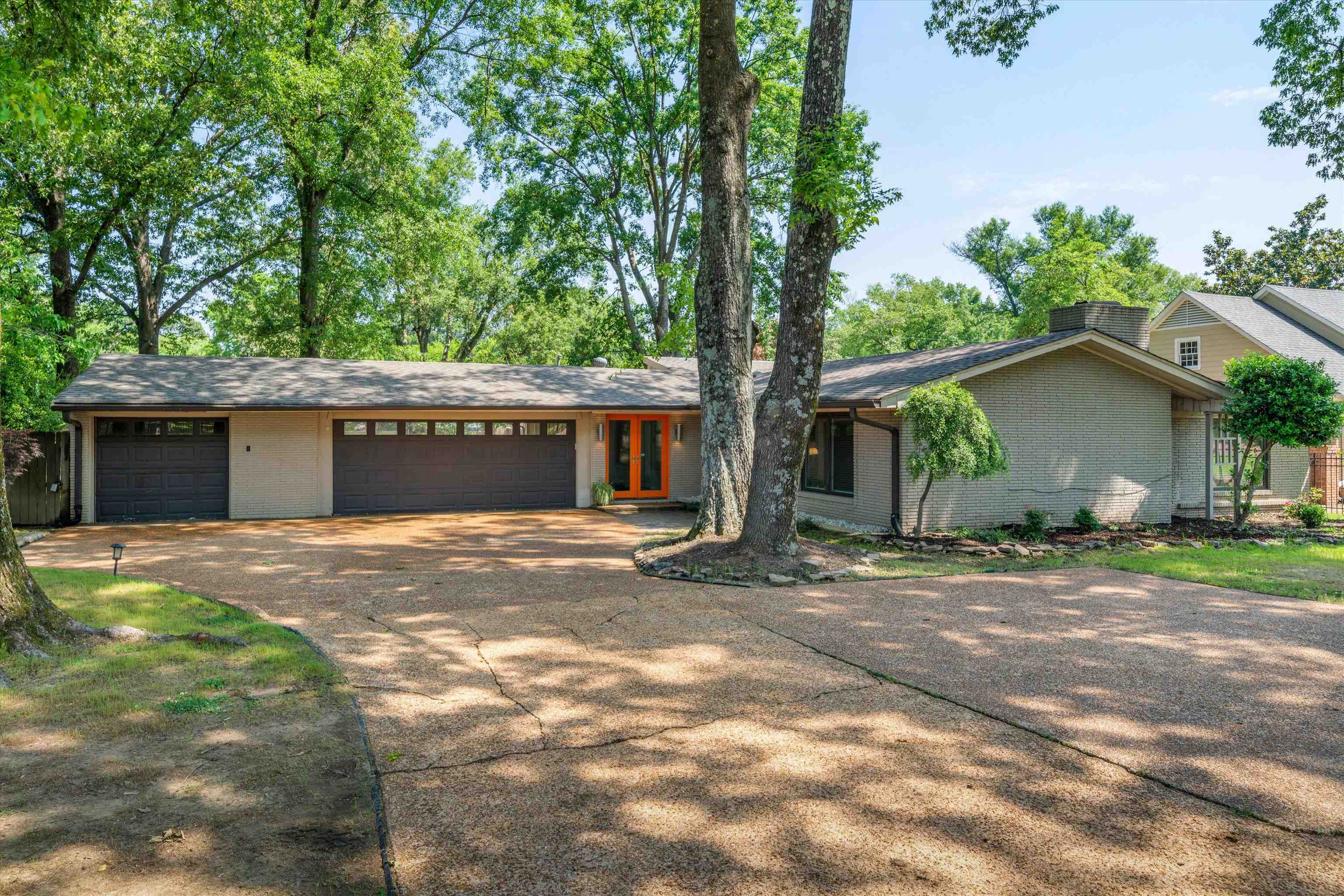 5420 Walnut Grove Road Memphis, TN 38120 - Photo 1 of 25 a view of a house with a yard and large tree