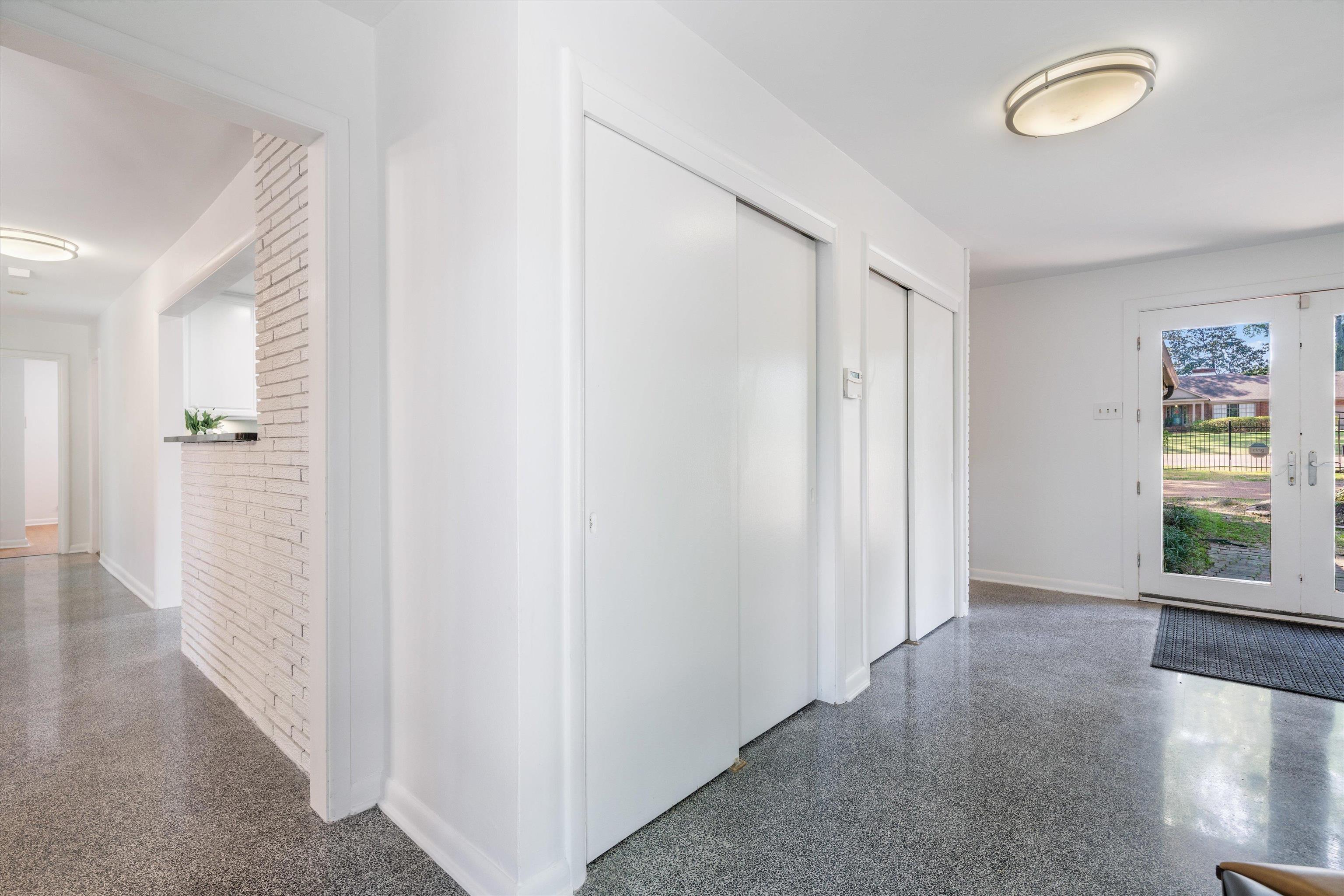 5420 Walnut Grove Road Memphis, TN 38120 - Photo 15 of 25 a view of a hallway with wooden floor and a room