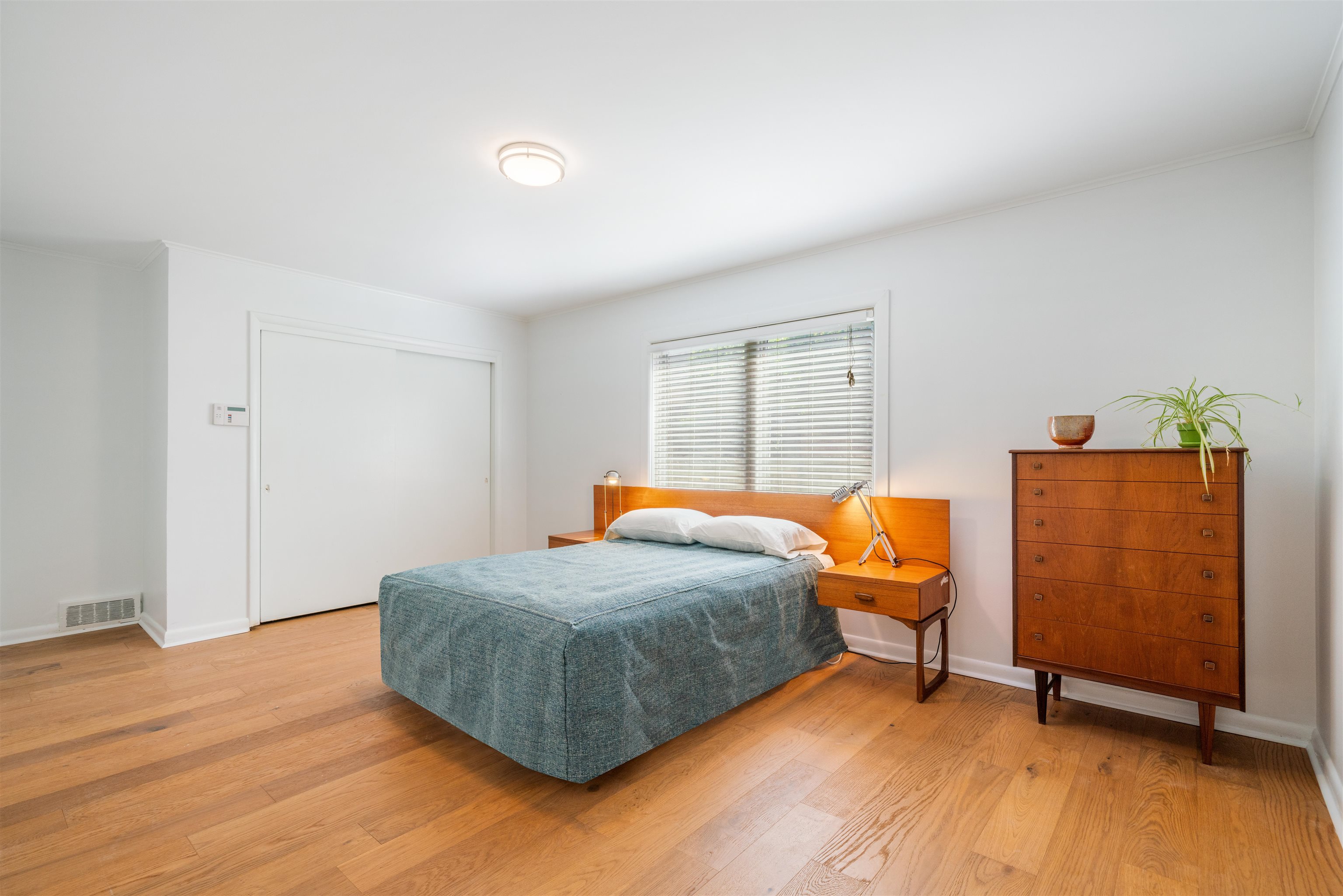5420 Walnut Grove Road Memphis, TN 38120 - Photo 25 of 25 a bedroom with a bed and wooden floor