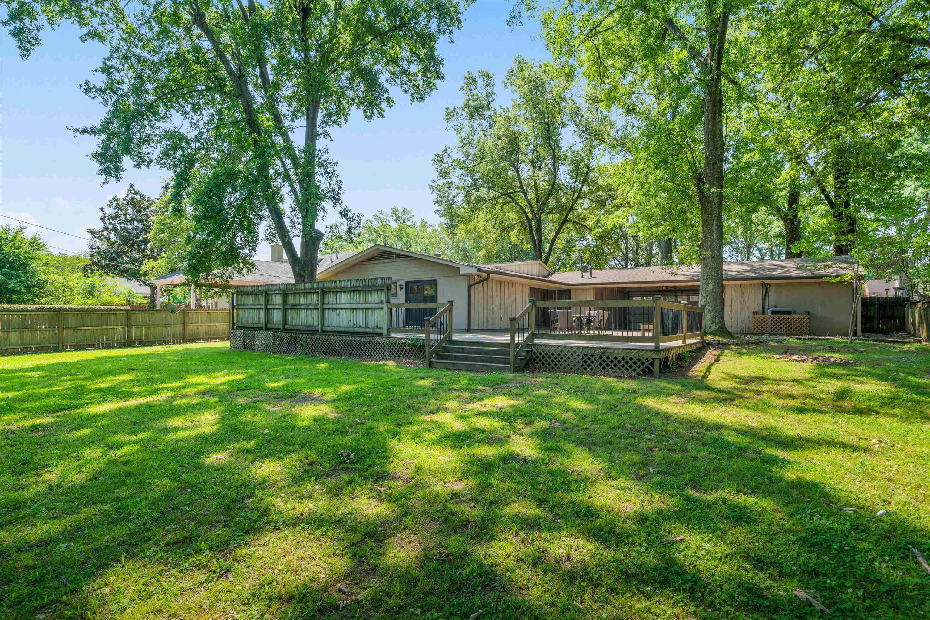 5420 Walnut Grove Road Memphis, TN 38120 - Photo 24 of 25 a front view of a house with yard and tree
