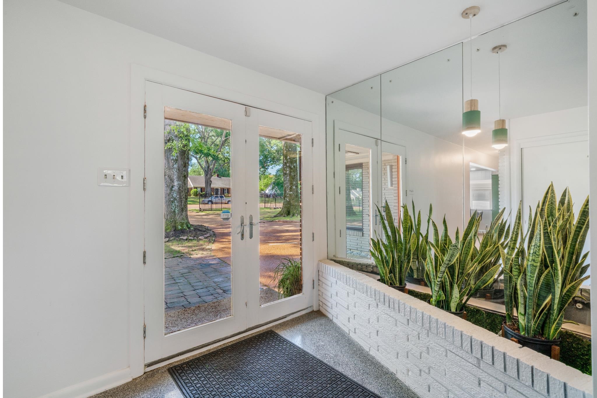 5420 Walnut Grove Road Memphis, TN 38120 - Photo 3 of 25 a living room with a potted plant