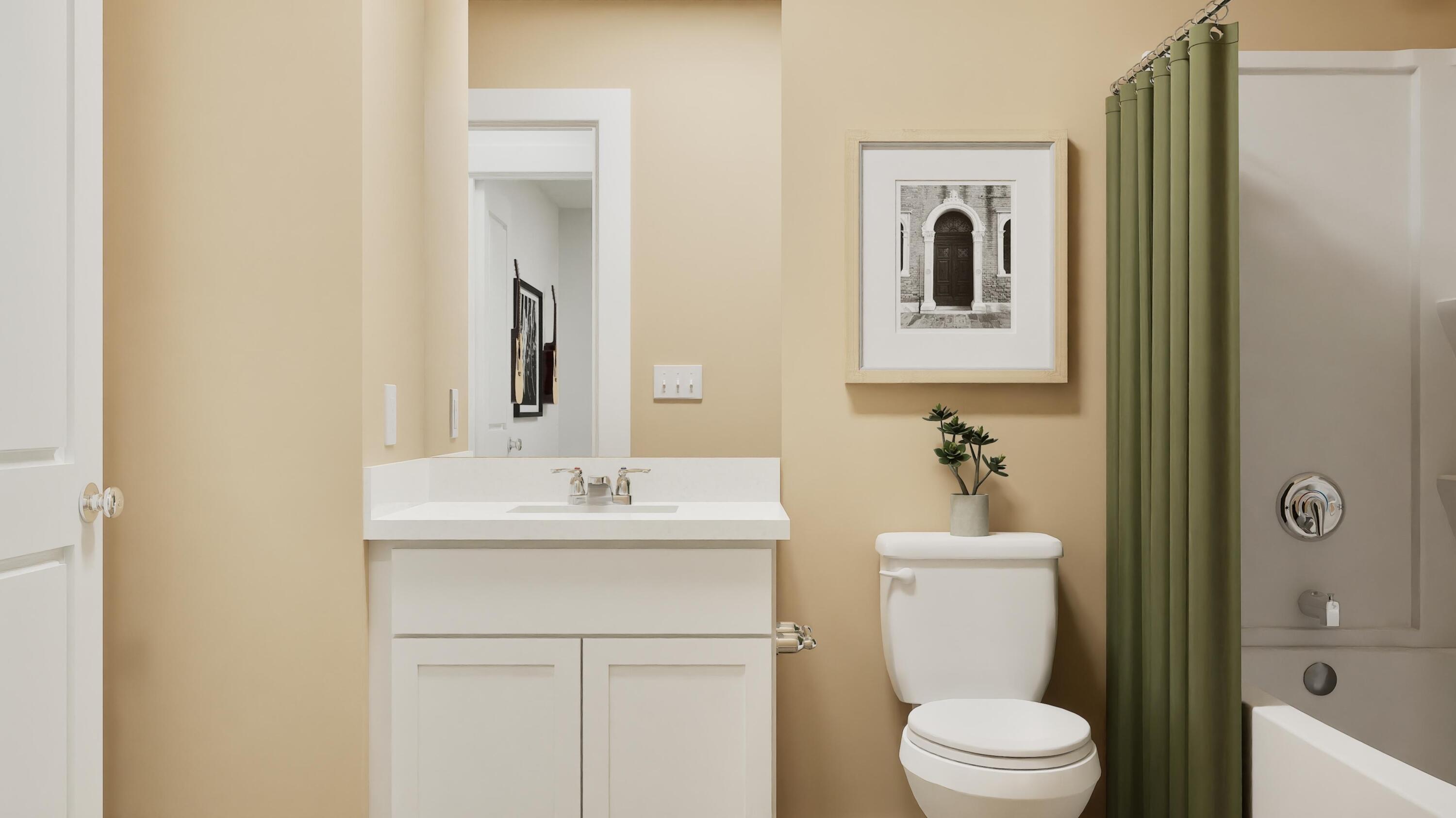 3784 Maple Street Portage, IN 46368 - Photo 3 of 21 a bathroom with a toilet a sink and mirror