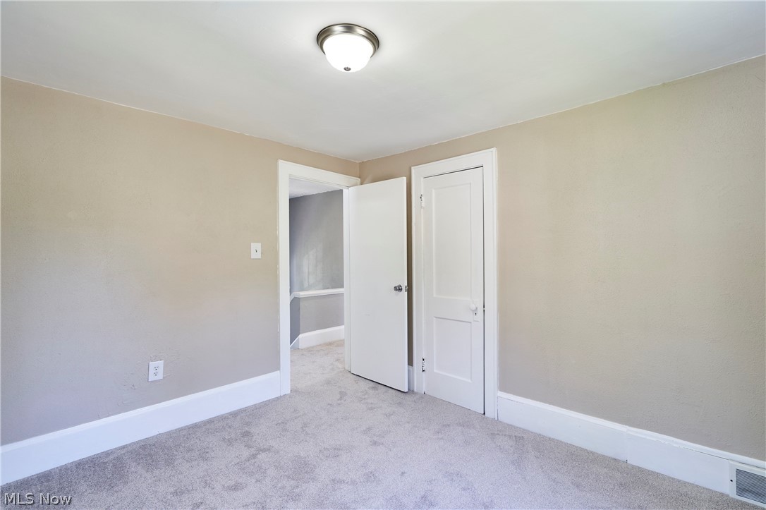 1102 Diagonal Road Akron, OH 44320 - Photo 21 of 27 Second bedroom with new carpet and closet space
